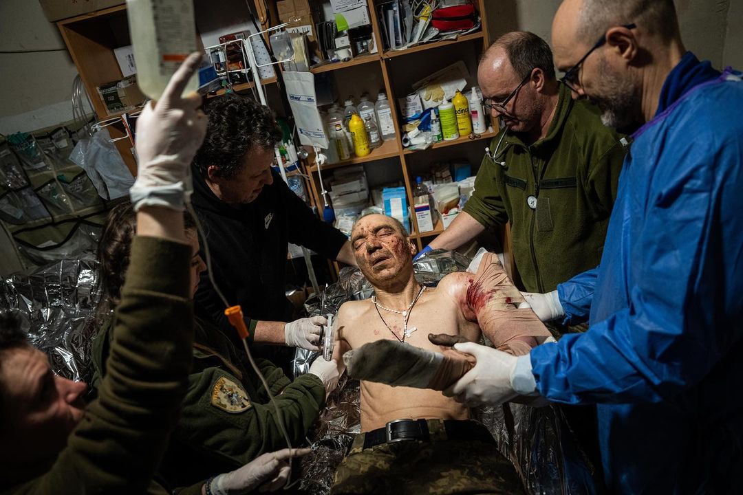 BAKHMUT, UKRAINE. In a field hospital treating wounded from the bloody battle...