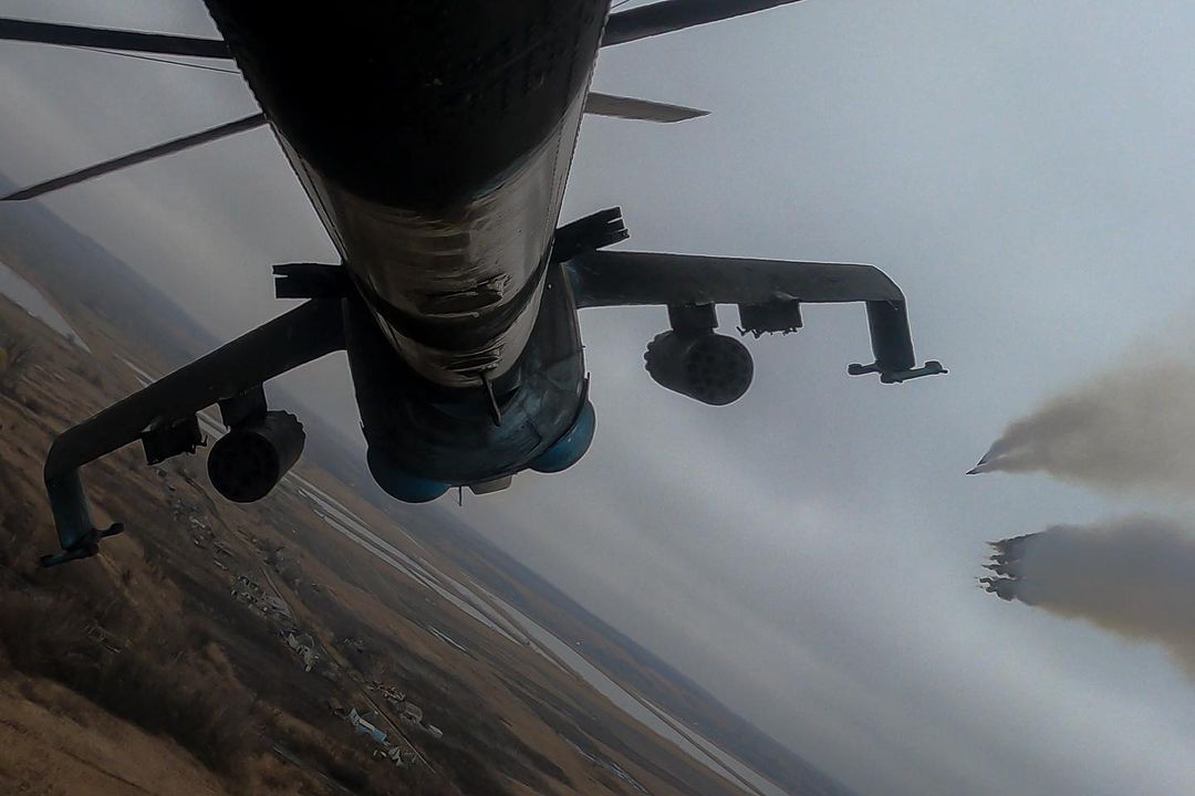 DONBAS, UKRAINE. Skimming the treetops, three Soviet-era attack helicopters b...